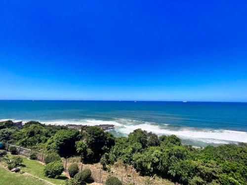 a view of the ocean from the top of a hill at Escape to 85 Cascades in Umdloti Beach in Umdloti