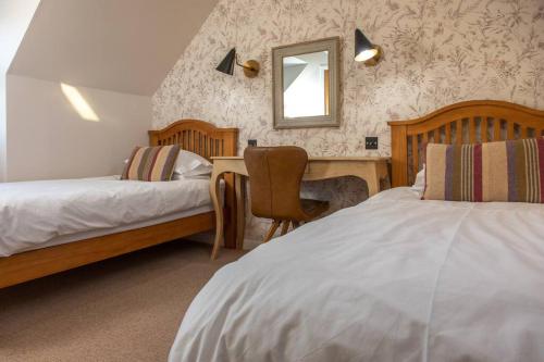 Postel nebo postele na pokoji v ubytování Breakish Cottage