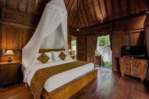 Postel nebo postele na pokoji v ubytování Andara Ubud Villa