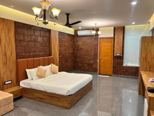 a bedroom with a bed in a room at Udaya Resort in Palakkad