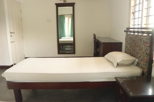 Ένα ή περισσότερα κρεβάτια σε δωμάτιο στο Fortbeach Service Apartments