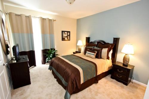 A bed or beds in a room at IT319 - Vista Cay Resort - 3 Bed 3,5 Baths Townhome