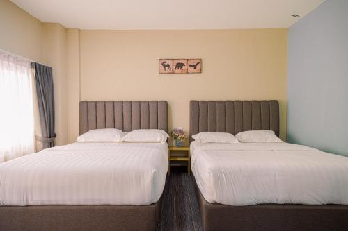 Postel nebo postele na pokoji v ubytování 3C HOTEL Setia Walk Puchong