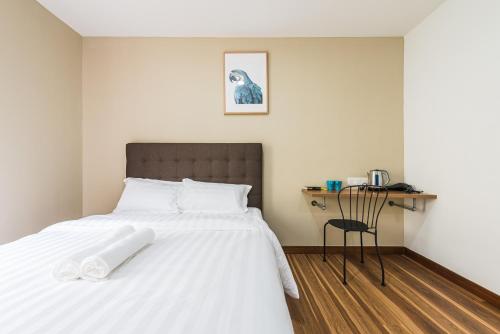 Postel nebo postele na pokoji v ubytování 3C HOTEL Setia Walk Puchong