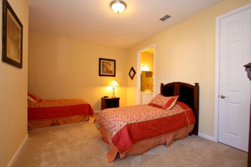 a bedroom with two beds in a room at IT212 - Vista Cay Resort - 2 Bed 2 Baths Condo in Orlando