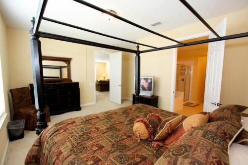 a bedroom with a large bed with a canopy at IT289 - Vista Cay Resort - 3 Bed 2 Baths Condo in Orlando