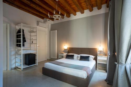 Un ou plusieurs lits dans un hébergement de l'établissement Foscà Venice Rooms