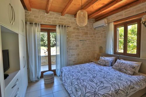 Ένα ή περισσότερα κρεβάτια σε δωμάτιο στο Villa Harmony, Steinvilla