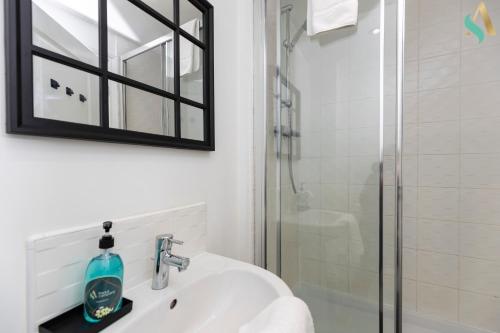 a bathroom with a sink and a shower at Mulberry Wynd TSAC in Stockton-on-Tees