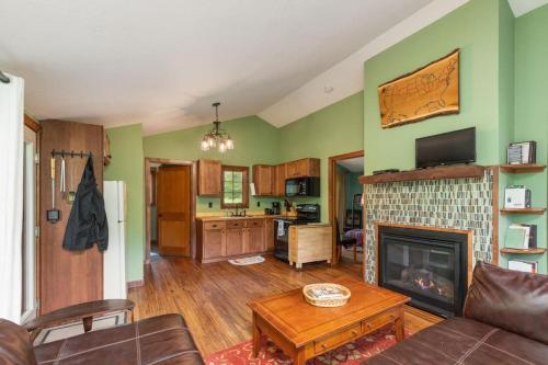 a living room with a couch and a fireplace at 2 bedroom-Riverfront-Fireplace - Pet ok in Pine City