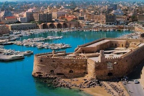 an aerial view of a harbor with boats at BRIO luxurious urban stay in Heraklio,WiFi,ΑC in Heraklio Town