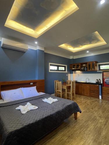 Кровать или кровати в номере Siquijor Plage Inn