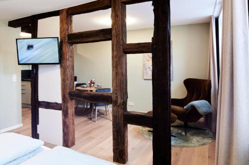 a living room with a large wooden framed mirror at Fachwerk-Romantik am Dom in Fulda