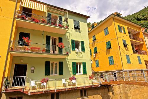 a group of buildings with flowers on their balconies at Camere Fontanavecchia in Vernazza