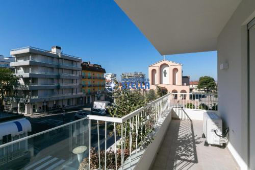 a balcony with a view of a city at Condominio Medusa in Lido di Jesolo