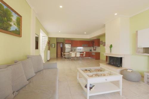 a living room with a couch and a table at Afitos Hidden Gems #FeelsLikeHome in Afitos