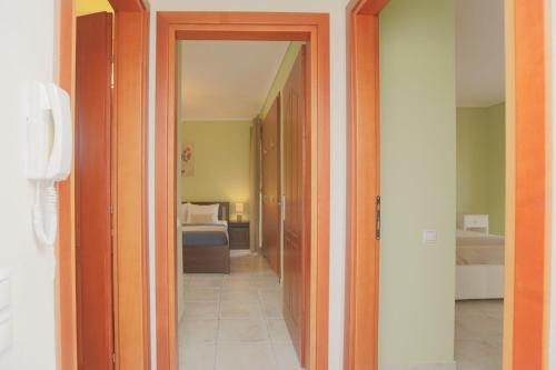 a hallway leading to a room with a bedroom at Afitos Hidden Gems #FeelsLikeHome in Afitos
