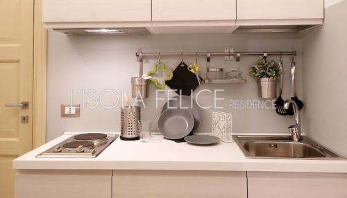 a kitchen with a sink and a counter top at L'isola Felice in Trapani