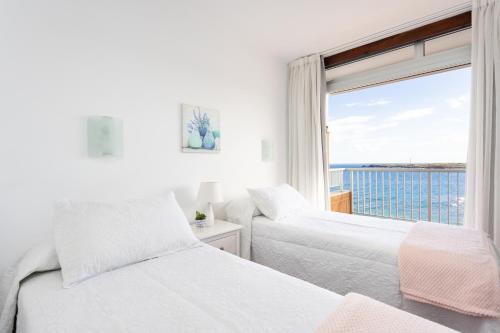 Ένα ή περισσότερα κρεβάτια σε δωμάτιο στο Home2Book Poris Ocean View