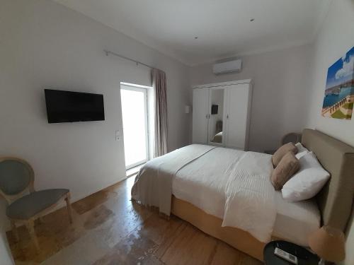 TV a/nebo společenská místnost v ubytování Palazzo Pisani Malta Boutique and SPA