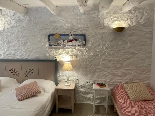 Ένα ή περισσότερα κρεβάτια σε δωμάτιο στο Maison PORTOKALIA