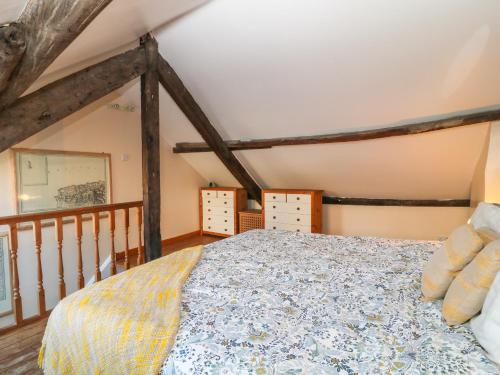 a bedroom with a large bed in a attic at 37 Market Street in Bideford