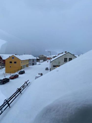 an aerial view of a town in the snow at Rooftop view apartment in Vardø