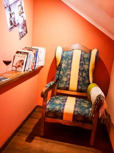 a chair sitting in a corner of a room at Gościna U kowala in Lachowice
