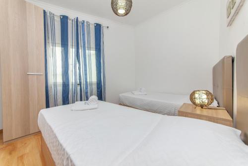 Postel nebo postele na pokoji v ubytování B81 - Casa do Outeiro Westcoast Home