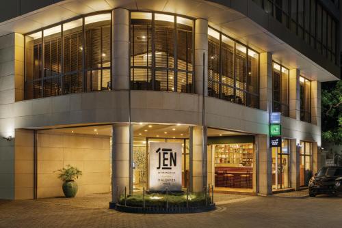 a building with a sign in front of it at Jen Maldives Male by Shangri-La in Male City