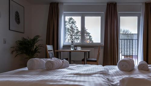 Ένα ή περισσότερα κρεβάτια σε δωμάτιο στο Motel Zur Dachsbaude