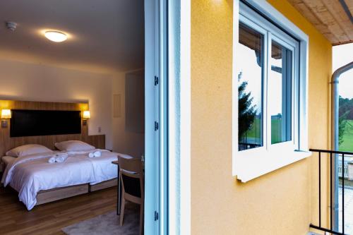 Ένα ή περισσότερα κρεβάτια σε δωμάτιο στο Motel Zur Dachsbaude