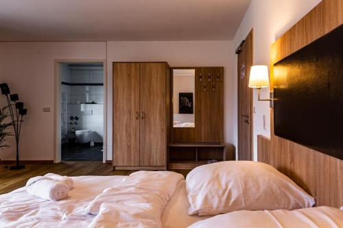 Ένα ή περισσότερα κρεβάτια σε δωμάτιο στο Motel Zur Dachsbaude