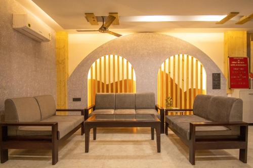 a waiting room with two couches and a table at Holy Shivana Boutique Hotel Rishikesh in Rishīkesh