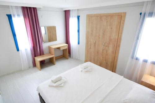Ein Bett oder Betten in einem Zimmer der Unterkunft Akay Garden Family Club