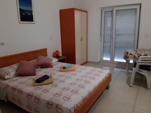 Ένα ή περισσότερα κρεβάτια σε δωμάτιο στο Apartments Franka Saplunara