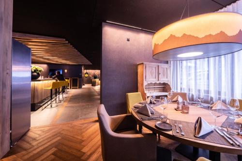 a dining room with a table and chairs at Hotel Krone - Aktiv & Erholt in Churwalden