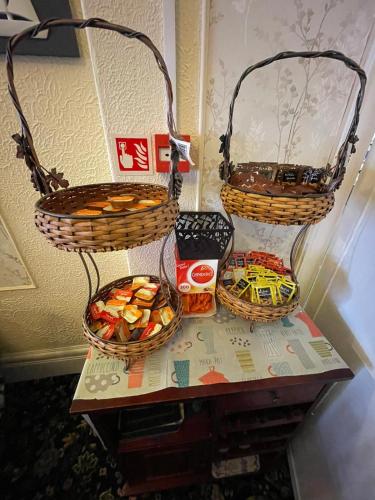 two baskets on a table with some snacks on it at Nevele in Blackpool