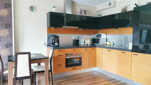 Kuchyňa alebo kuchynka v ubytovaní Apartment Gdańsk Seaside & City Center