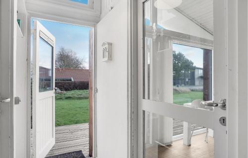 an open door to a porch with a view of a yard at Amazing Home In Frederikshavn With Wifi in Frederikshavn