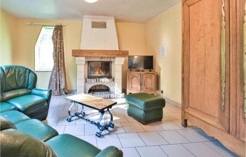 a living room with a couch and a fireplace at Amazing Home In Bonneville-La-Louvet in Bonneville-la-Louvet