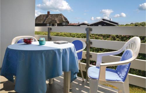 a blue table and chairs on a balcony at Cozy Apartment In Ringkøbing in Ringkøbing