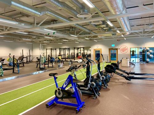 a gym with treadmills and exercise bikes in it at Best Western Plus Åby Hotel in Mölndal