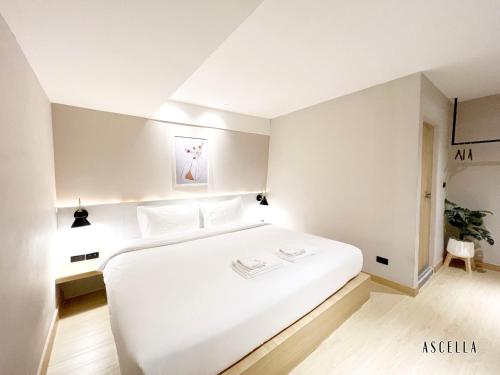 Ascella Bangkok Hotelにあるベッド