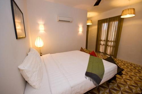 
Letto o letti in una camera di Bambu Hotel

