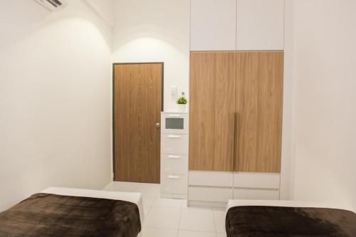 Ein Bett oder Betten in einem Zimmer der Unterkunft ALOR SETAR IMPERIO PROFESSIONAL SUITE by Zenith Smart