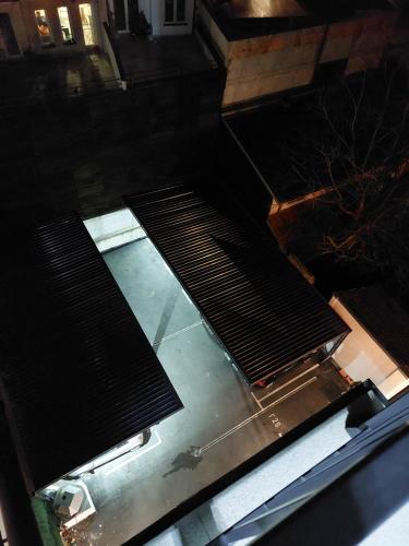 an overhead view of an escalator in a building at Apartman M 21 in Karaburma