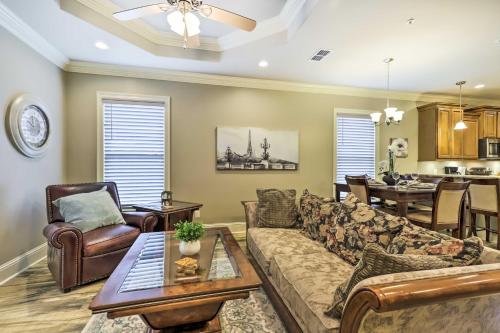 a living room with a couch and a table at Diamondhead Condo - Marina, Pool Access and Golfing! in Diamondhead