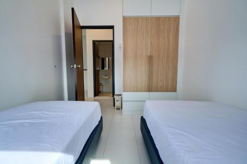 Ein Bett oder Betten in einem Zimmer der Unterkunft ALOR SETAR IMPERIO PROFESSIONAL SUITE by Zenith Smart