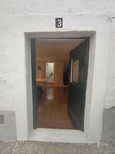 a door in a building with the number three at Historic Torres Vedras in Torres Vedras